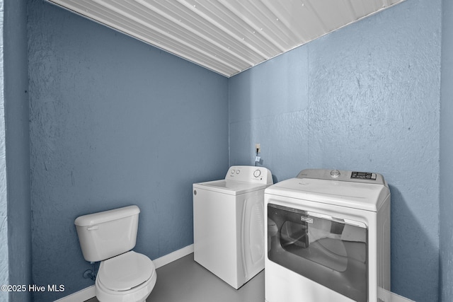 laundry room with independent washer and dryer, baseboards, and laundry area