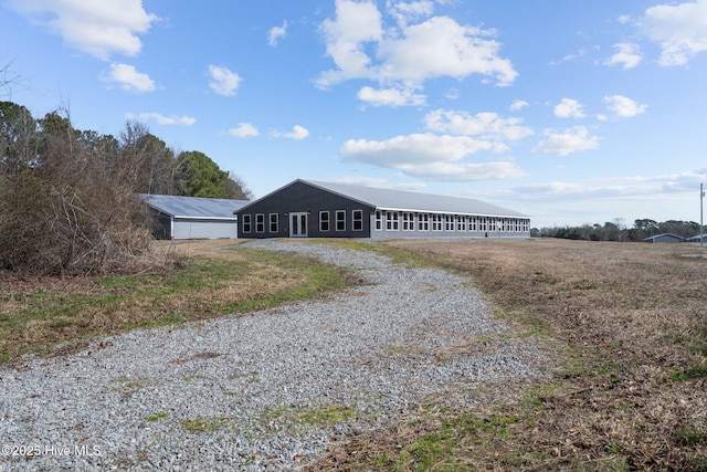 view of outdoor structure featuring driveway