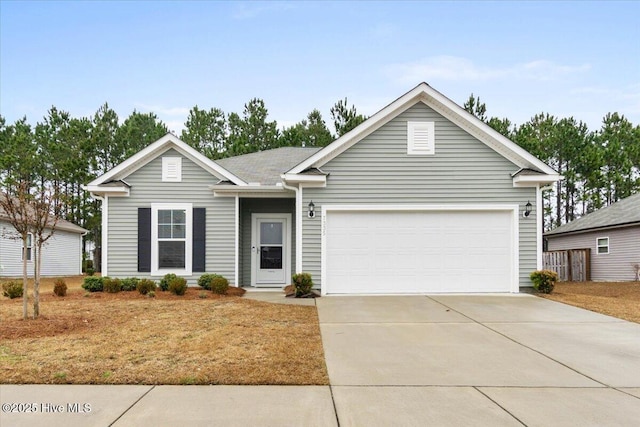 single story home with a garage and driveway