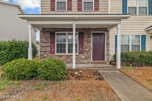 property entrance with covered porch