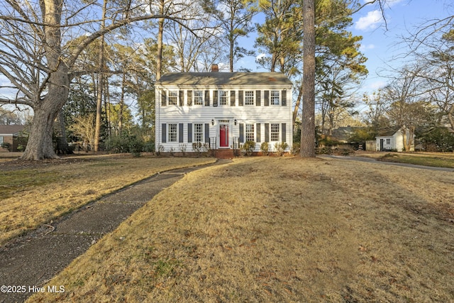 colonial home with a front yard