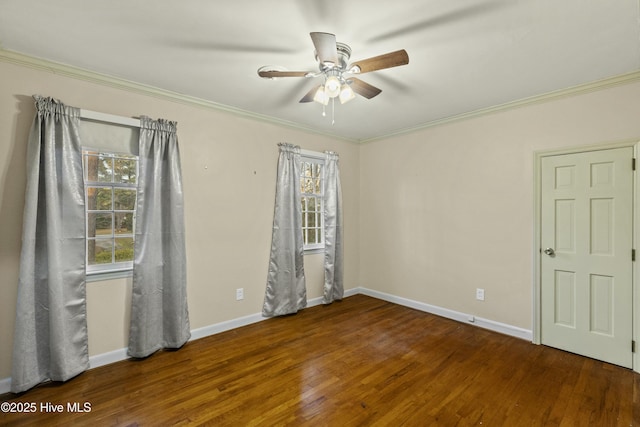 spare room with hardwood / wood-style floors, crown molding, and plenty of natural light