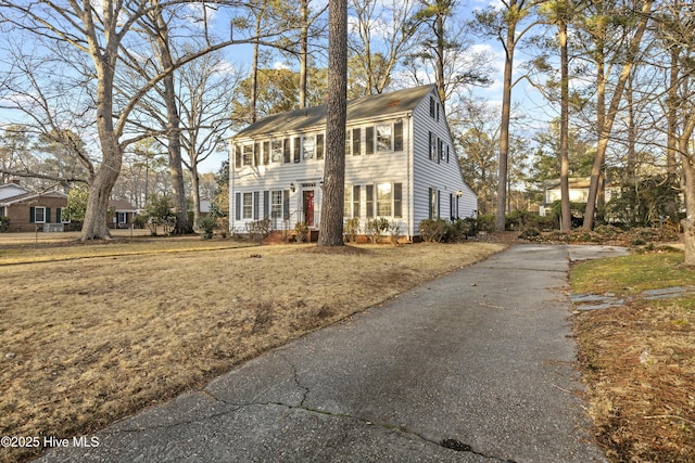 colonial house with aphalt driveway