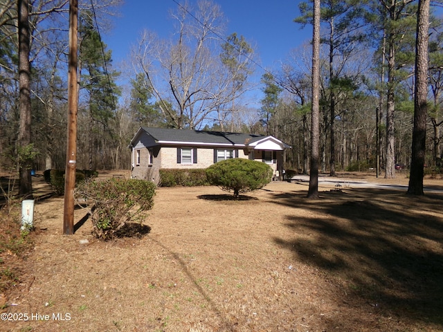 view of front of house with brick siding