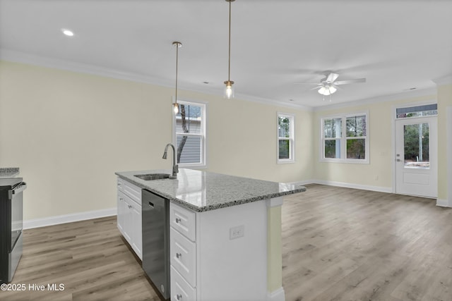 kitchen with dishwasher, light stone counters, white cabinets, decorative light fixtures, and sink