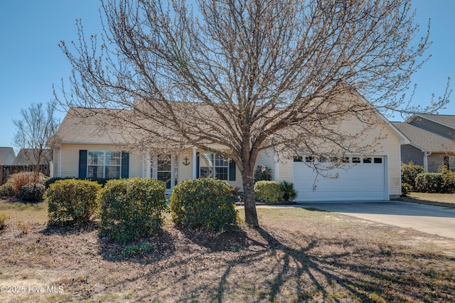 ranch-style home with driveway and an attached garage