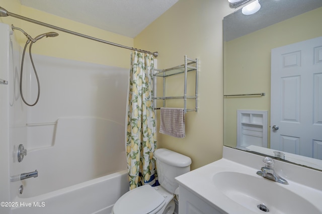 bathroom with toilet, a textured ceiling, shower / tub combo with curtain, and vanity