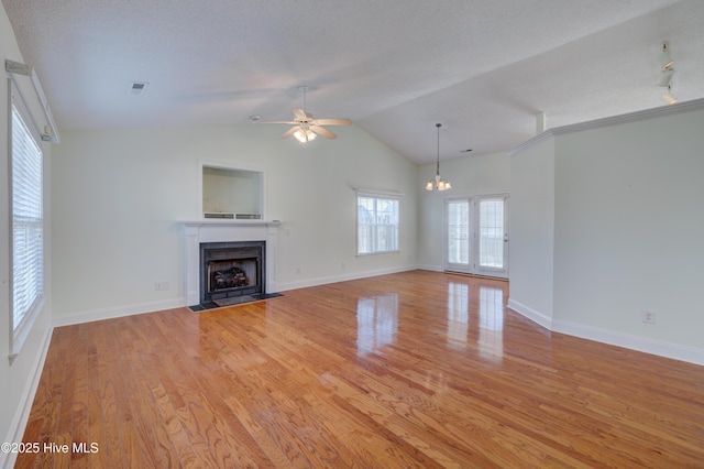 unfurnished living room featuring a fireplace with flush hearth, visible vents, light wood-style flooring, and baseboards