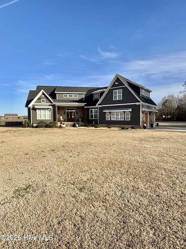 view of front facade with a garage and a front yard