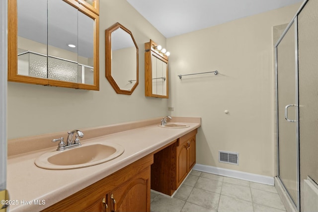 full bath with double vanity, visible vents, a sink, and tile patterned floors