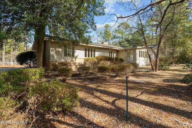 view of front of property featuring a chimney