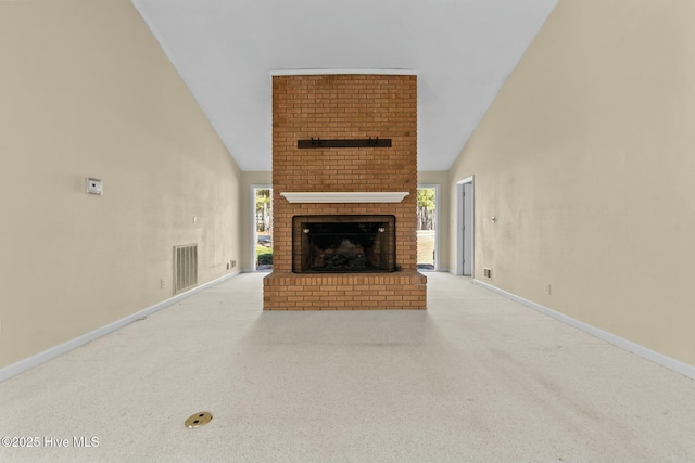 unfurnished living room with a brick fireplace, light colored carpet, visible vents, and baseboards