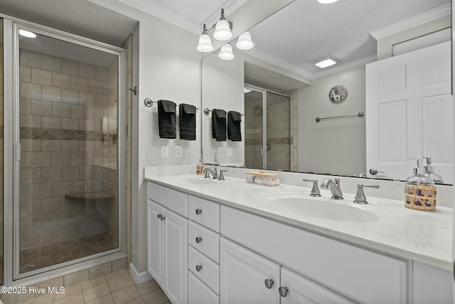 bathroom featuring a stall shower, tile patterned flooring, a sink, and crown molding