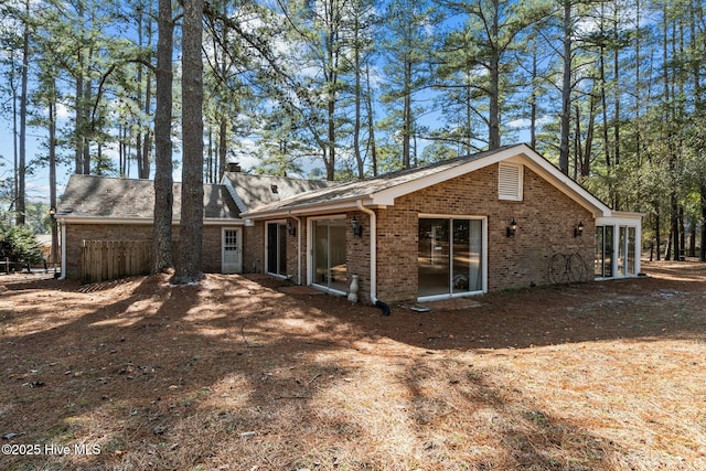 back of house with brick siding