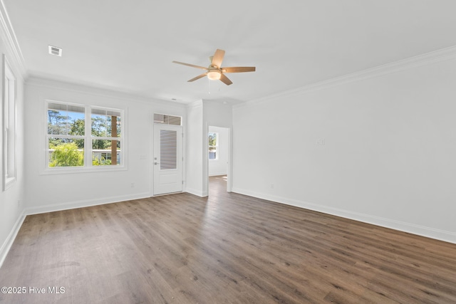 211 NE 78th St, Oak Island, NC 28465 - unfurnished living room featuring a ceiling fan, ornamental molding, wood finished floors, and baseboards