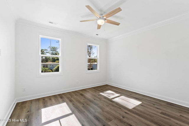 211 NE 78th St, Oak Island, NC 28465 - spare room featuring ornamental molding, wood finished floors, baseboards, and a ceiling fan