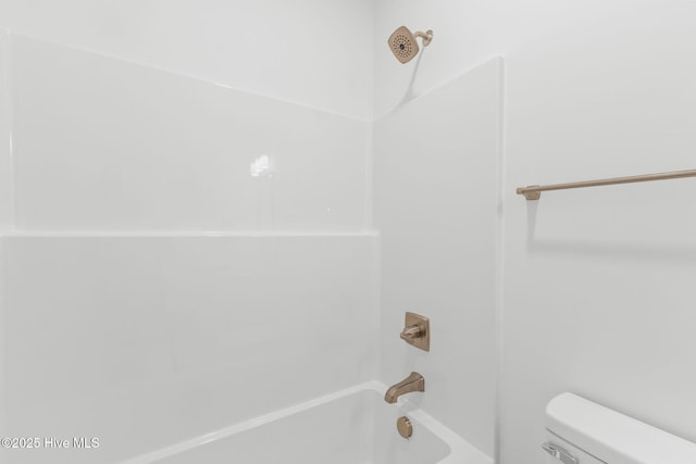 211 NE 78th St, Oak Island, NC 28465 - bathroom featuring toilet and shower / bathtub combination