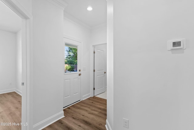211 NE 78th St, Oak Island, NC 28465 - hall featuring wood finished floors, baseboards, ornamental molding, and recessed lighting