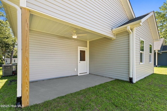 211 NE 78th St, Oak Island, NC 28465 - doorway to property with a lawn, a ceiling fan, and a patio