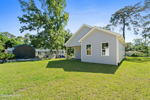 211 NE 78th St, Oak Island, NC 28465 - rear view of house with a lawn