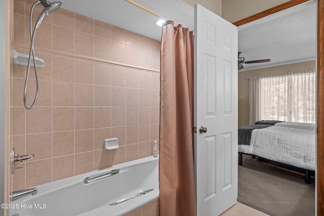 ensuite bathroom with a textured ceiling, ensuite bath, a ceiling fan, and shower / bathtub combination with curtain