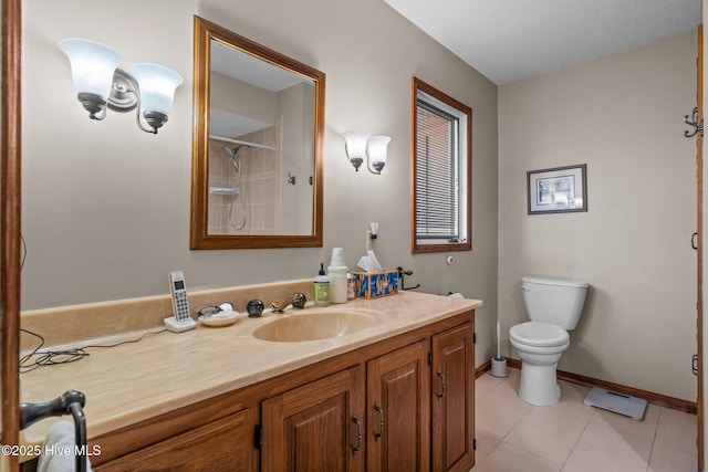 full bath featuring baseboards, a shower, toilet, tile patterned flooring, and vanity