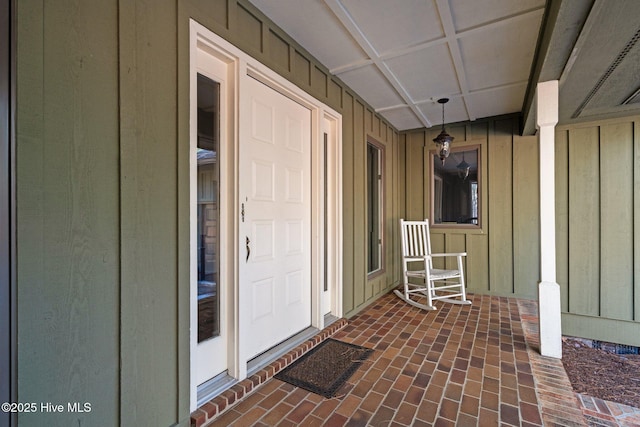 doorway to property featuring a porch