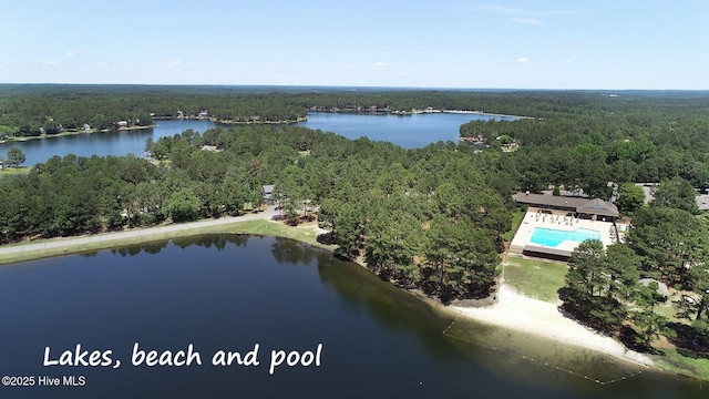 aerial view with a water view and a forest view