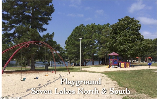 community play area featuring a yard