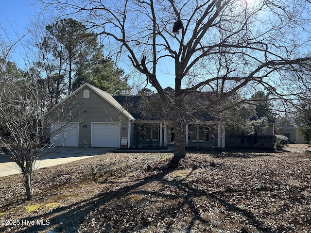 view of front of property with a garage and driveway