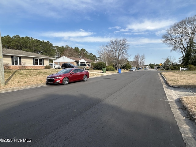 view of street featuring curbs