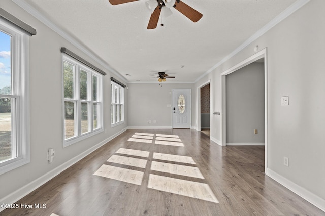 interior space featuring hardwood / wood-style flooring and ornamental molding