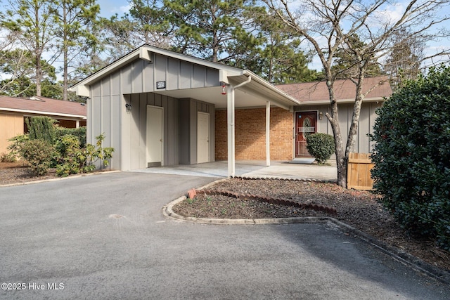 view of front of property with a carport