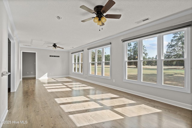 interior space featuring a textured ceiling, crown molding, ceiling fan, and wood-type flooring