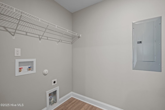 laundry area with laundry area, washer hookup, baseboards, hookup for an electric dryer, and electric panel