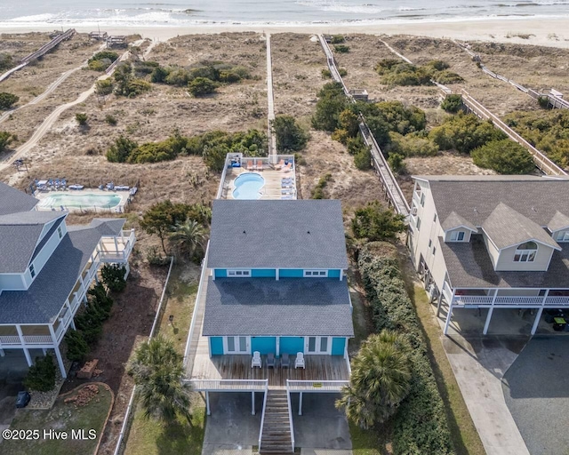 birds eye view of property featuring a view of the beach