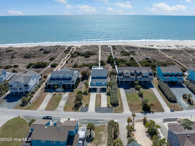 bird's eye view with a water view, a residential view, and a view of the beach