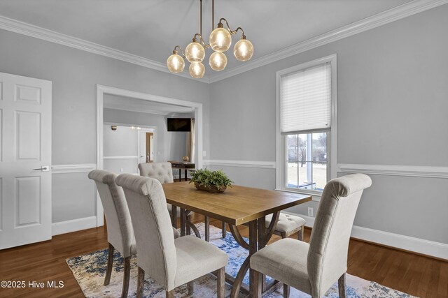 1307 Edgewater Club Rd, Wilmington, NC 28411 - dining room featuring crown molding, wood finished floors, baseboards, and a chandelier