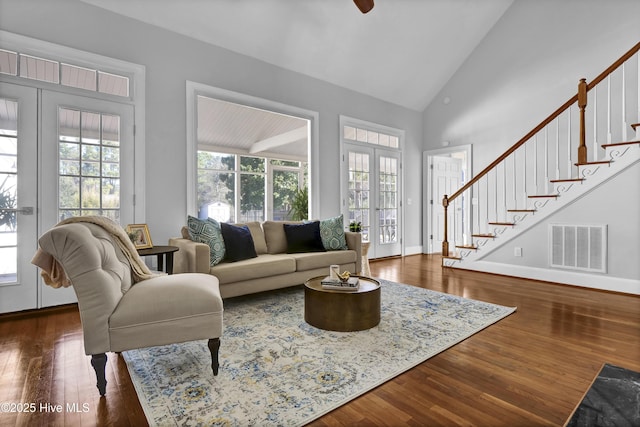 1307 Edgewater Club Rd, Wilmington, NC 28411 - living area featuring healthy amount of natural light, stairs, wood finished floors, and high vaulted ceiling