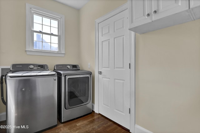 1307 Edgewater Club Rd, Wilmington, NC 28411 - washroom with cabinet space, washing machine and dryer, dark wood-type flooring, and baseboards
