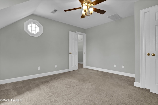 1307 Edgewater Club Rd, Wilmington, NC 28411 - unfurnished bedroom featuring carpet flooring, vaulted ceiling, a spacious closet, a ceiling fan, and a closet