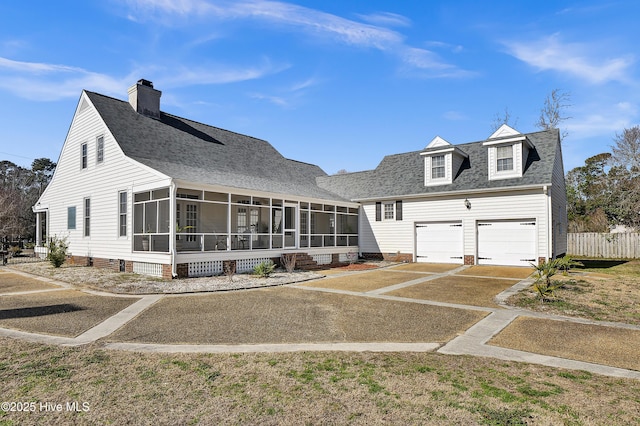 1307 Edgewater Club Rd, Wilmington, NC 28411 - view of front of house featuring a sunroom, concrete driveway, fence, roof with shingles, and an attached garage
