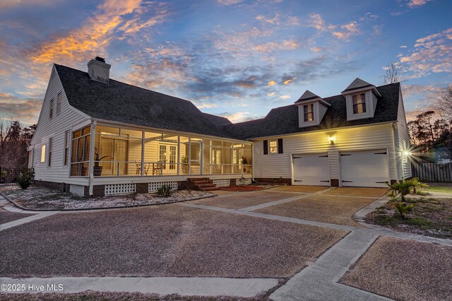 1307 Edgewater Club Rd, Wilmington, NC 28411 - view of front facade with driveway, covered porch, a garage, french doors, and roof with shingles