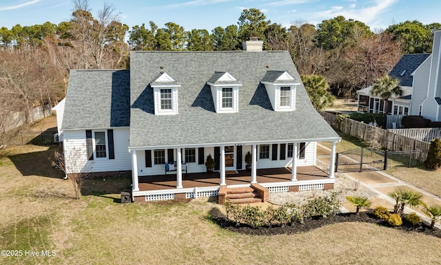 1307 Edgewater Club Rd, Wilmington, NC 28411 - view of front facade with a gate, a porch, a shingled roof, and a chimney