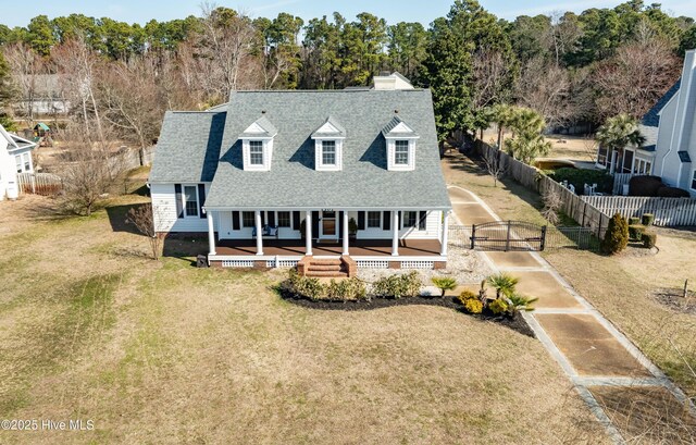 1307 Edgewater Club Rd, Wilmington, NC 28411 - view of front of home featuring a gate, roof with shingles, covered porch, and a chimney