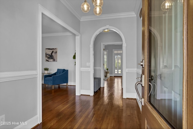 1307 Edgewater Club Rd, Wilmington, NC 28411 - foyer featuring dark wood-type flooring, arched walkways, a chandelier, ornamental molding, and baseboards