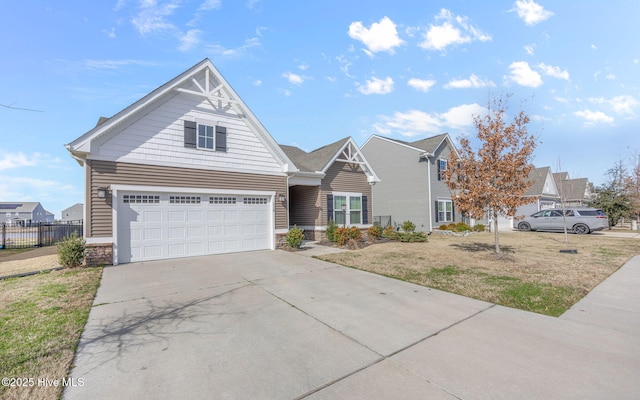 view of front of home with a front yard and a garage