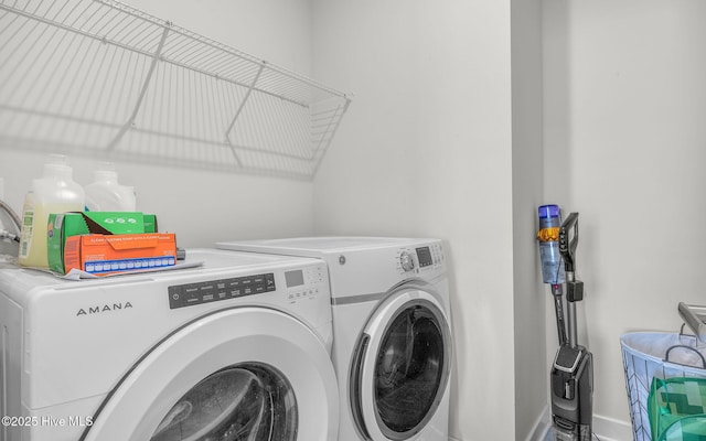 laundry room featuring separate washer and dryer