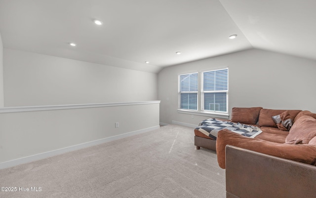 living room featuring vaulted ceiling and light colored carpet