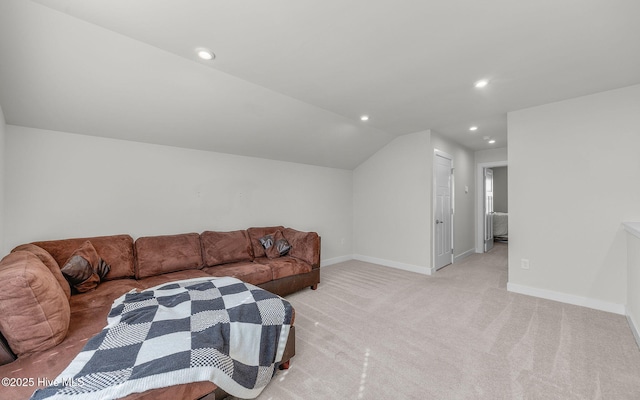 carpeted living room with lofted ceiling